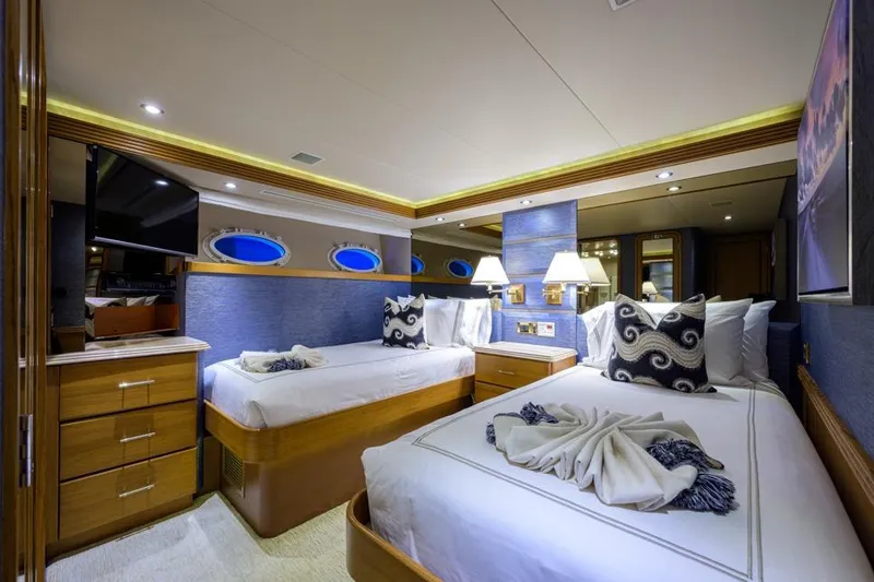 Slide: The Image of Luxurious bedroom in 2001 Westport Motor Yacht Raised Pilothouse, featuring elegant decor and twin beds. - 55