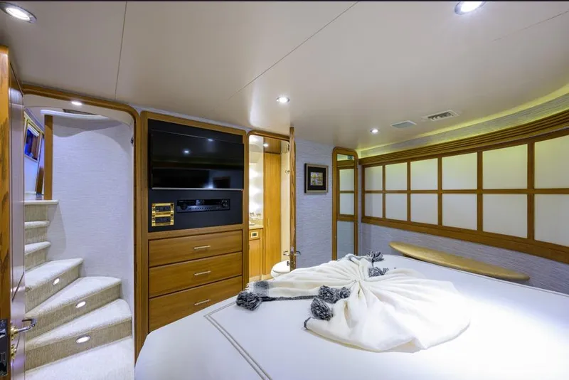 Slide: The Image of Luxurious 2001 Westport Motor Yacht interior with elegant bedroom and modern amenities. - 59