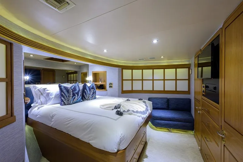 Slide: The Image of Luxurious bedroom in 2001 Westport Motor Yacht Raised Pilothouse with elegant decor and cozy seating. - 61