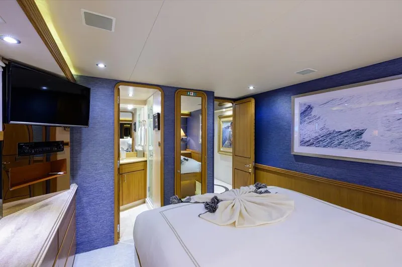 Slide: The Image of Luxurious bedroom interior of 2001 Westport Motor Yacht Raised Pilothouse, featuring elegant decor. - 65