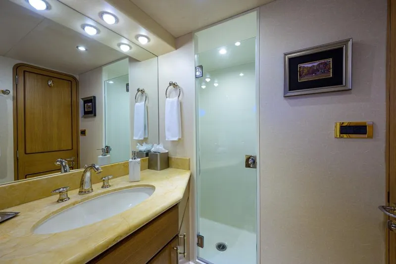 Slide: The Image of Luxurious bathroom in 2001 Westport Motor Yacht Raised Pilothouse, featuring elegant fixtures and lighting. - 66