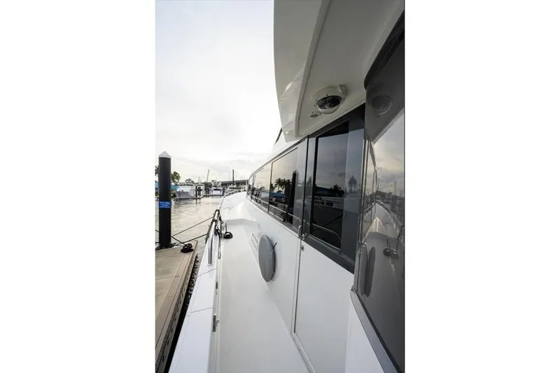 Slide: The Image of 2001 Westport Motor Yacht Raised Pilothouse docked at marina, side view. - 71