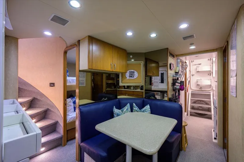 Slide: The Image of Interior of 2001 Westport Motor Yacht Raised Pilothouse with cozy dining area and modern amenities. - 73