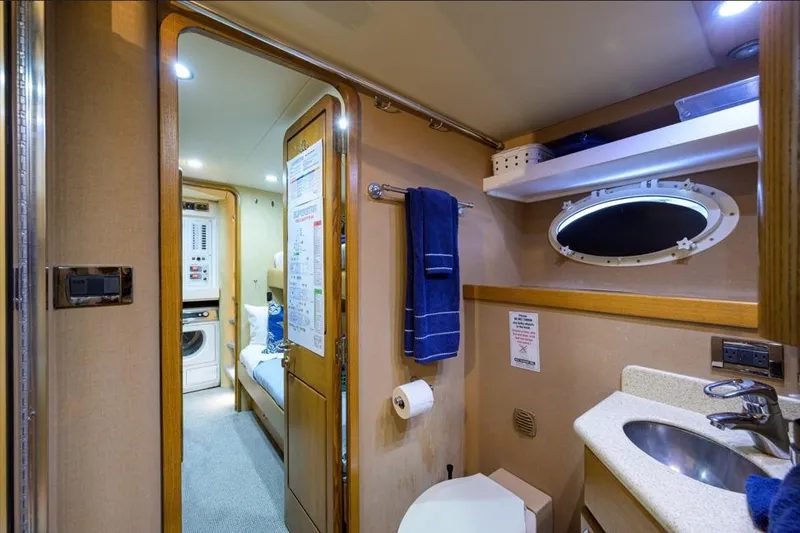 Slide: The Image of Luxurious bathroom in 2001 Westport Motor Yacht Raised Pilothouse, featuring modern amenities. - 81