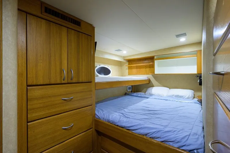 Slide: The Image of Luxurious cabin interior of 2001 Westport Motor Yacht Raised Pilothouse with wooden furnishings. - 84