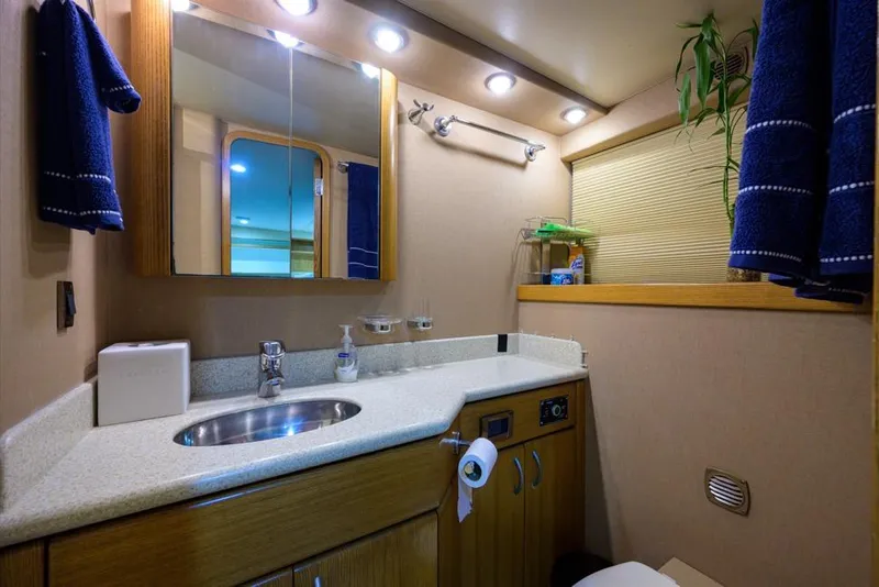 Slide: The Image of Luxurious bathroom in 2001 Westport Motor Yacht Raised Pilothouse, featuring modern fixtures and elegant design. - 85