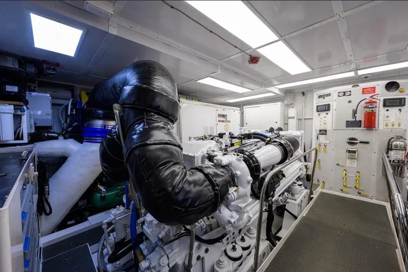 Slide: The Image of Engine room of 2001 Westport Motor Yacht Raised Pilothouse, featuring advanced machinery and controls. - 88