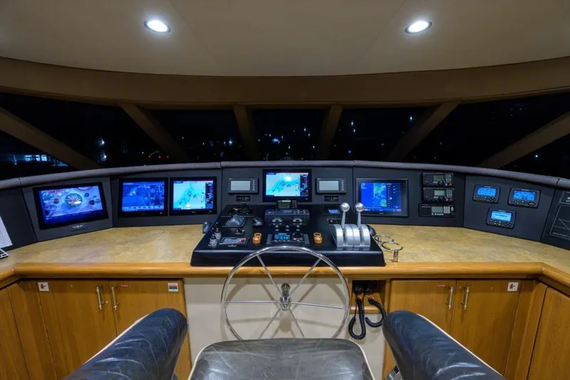 Slide: The Image of Pilothouse of 2001 Westport Motor Yacht Raised Pilothouse with navigation screens and controls. - 9