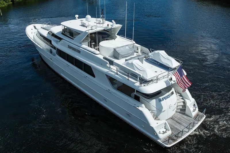 Slide: The Image of 2001 Westport Motor Yacht Raised Pilothouse cruising on a calm waterway. - 93