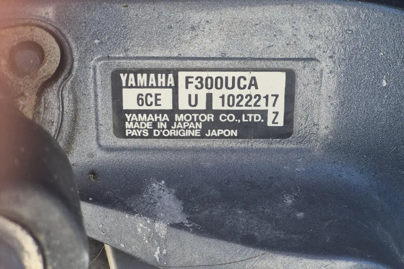 Slide: The Image of Yamaha F300UCA engine label on 2015 Robalo R242 Center Console boat. - 13