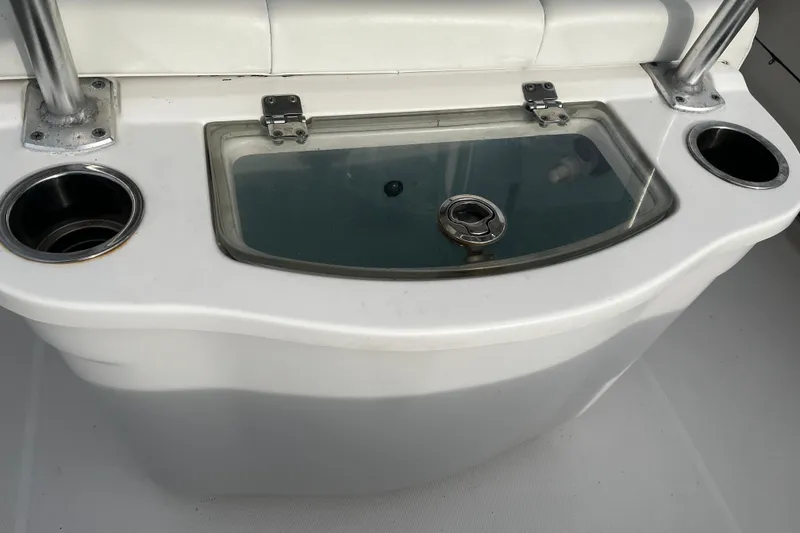 Slide: The Image of 2015 Robalo R242 Center Console livewell with cup holders and stainless steel fittings. - 47