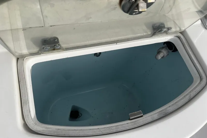 Slide: The Image of Livewell compartment on a 2015 Robalo R242 Center Console boat. - 48