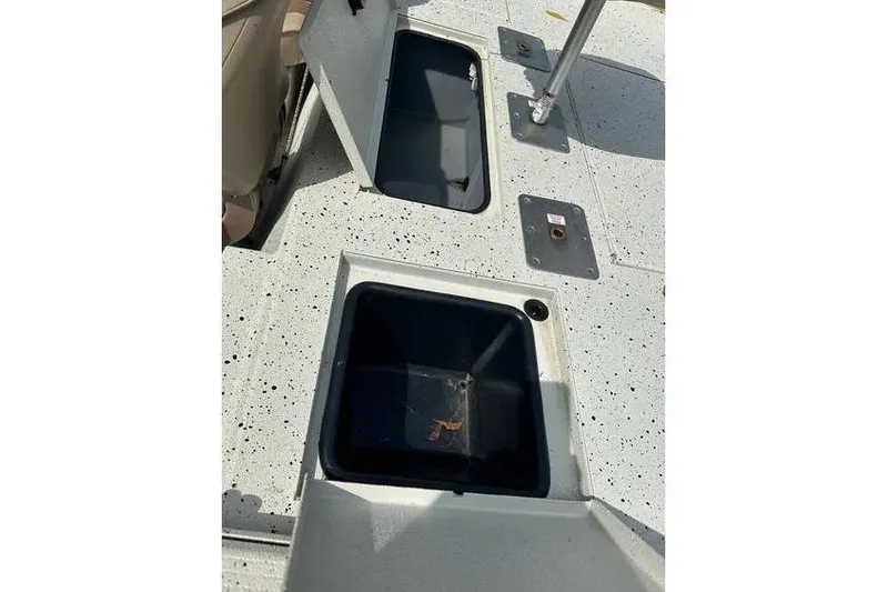 Slide: The Image of 2020 Xpress XP170 boat deck with open storage compartments. - 8