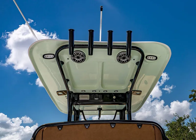 Slide: The Image of 2026 Sea Hunt Ultra 275 SE boat canopy against a clear blue sky. - 13