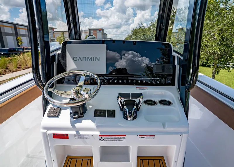 Slide: The Image of 2026 Sea Hunt Ultra 275 SE boat dashboard with Garmin navigation system and steering wheel. - 20