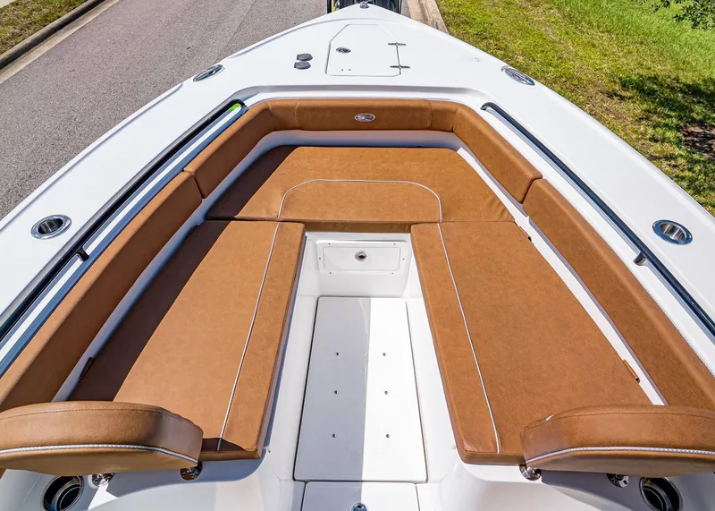 Slide: The Image of 2026 Sea Hunt Ultra 275 SE boat with brown cushioned seating and sleek design. - 27