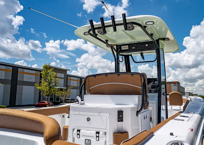 Slide: The Image of 2026 Sea Hunt Ultra 275 SE boat with sleek design, under a bright blue sky. - 5