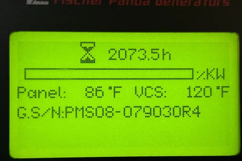 Slide: The Image of Display screen showing generator hours and temperatures on a 2013 Pursuit OS 385 Offshore. - 18