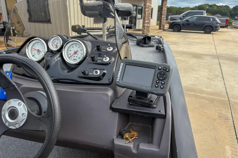 Slide: The Image of 2023 Tracker Pro 170 boat dashboard with gauges and Lowrance fish finder. - 5