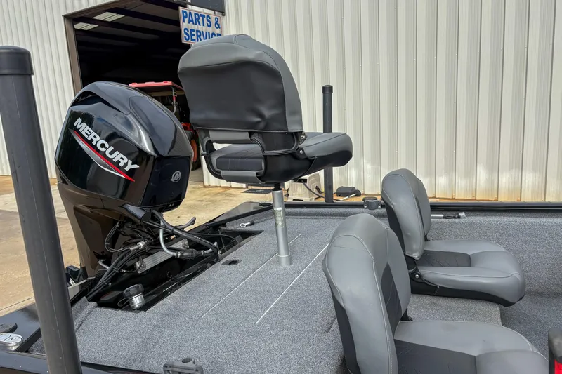 Slide: The Image of 2023 Tracker Pro 170 boat interior with Mercury engine and seating. - 6