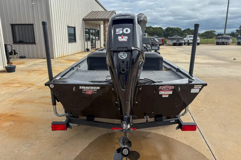 Slide: The Image of 2023 Tracker Pro 170 boat with Mercury 50 engine, parked outdoors. - 7