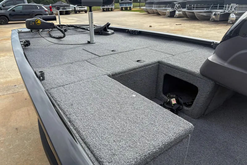 Slide: The Image of 2023 Tracker Pro 170 boat deck with storage compartments and trolling motor. - 8