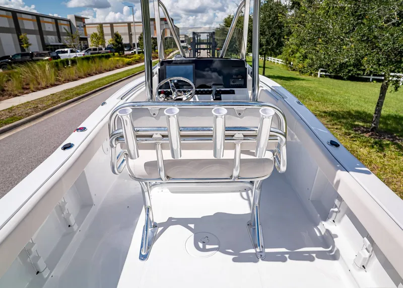 Slide: The Image of 2026 Sea Hunt Ultra 219 boat interior with steering console and rod holders. - 6
