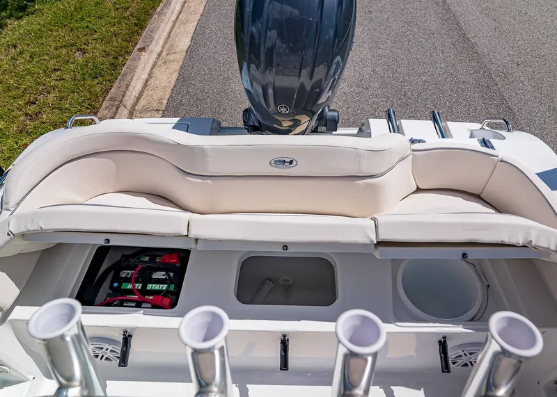 Slide: The Image of 2026 Sea Hunt Ultra 219 boat with cushioned seating and storage compartments. - 7