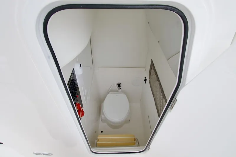 Slide: The Image of 2026 Regulator 25 boat interior with compact marine toilet. - 28