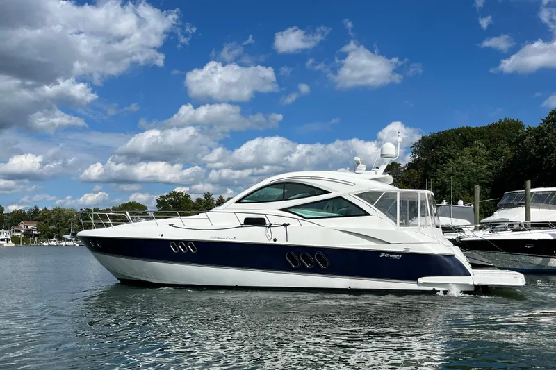 Slide: The Image of Luxurious 2010 Cruisers Yachts 520 Sports Coupe kitchen with modern appliances and elegant wood finish. - 19