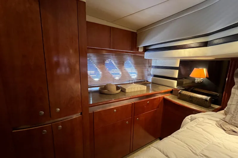 Slide: The Image of Luxurious cabin interior of 2010 Cruisers Yachts 520 Sports Coupe with wooden cabinetry. - 23