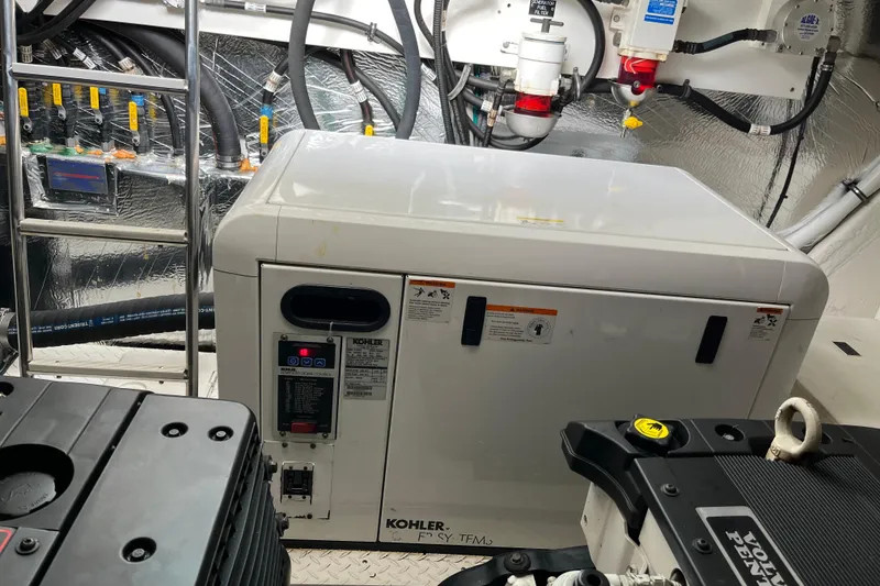 Slide: The Image of Engine room of 2010 Cruisers Yachts 520 Sports Coupe with Kohler generator. - 28