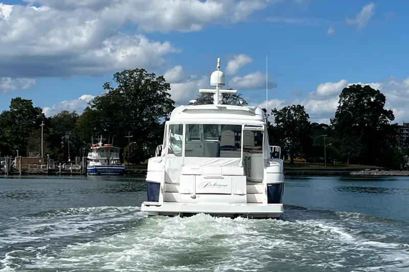 Slide: The Image of Cockpit of 2010 Cruisers Yachts 520 Sports Coupe with advanced navigation controls. - 14