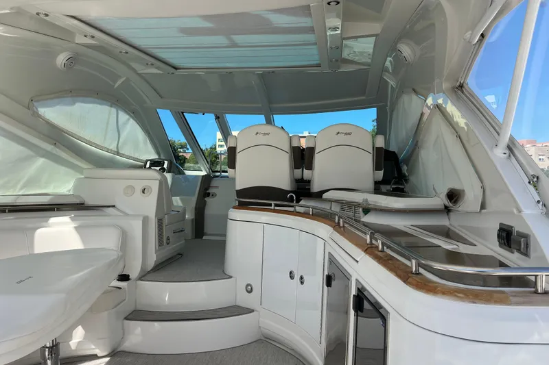 Slide: The Image of Interior of 2010 Cruisers Yachts 520 Sports Coupe, featuring sleek seating and modern design. - 16