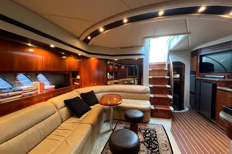 Slide: The Image of Luxurious interior of 2010 Cruisers Yachts 520 Sports Coupe with elegant seating and wooden finishes. - 17