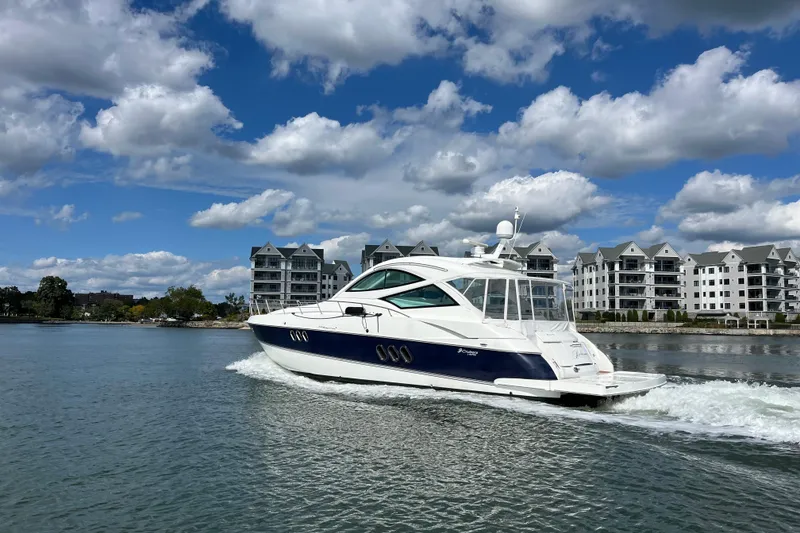 Slide: The Image of Luxurious interior of 2010 Cruisers Yachts 520 Sports Coupe with leather seating and wooden accents. - 18