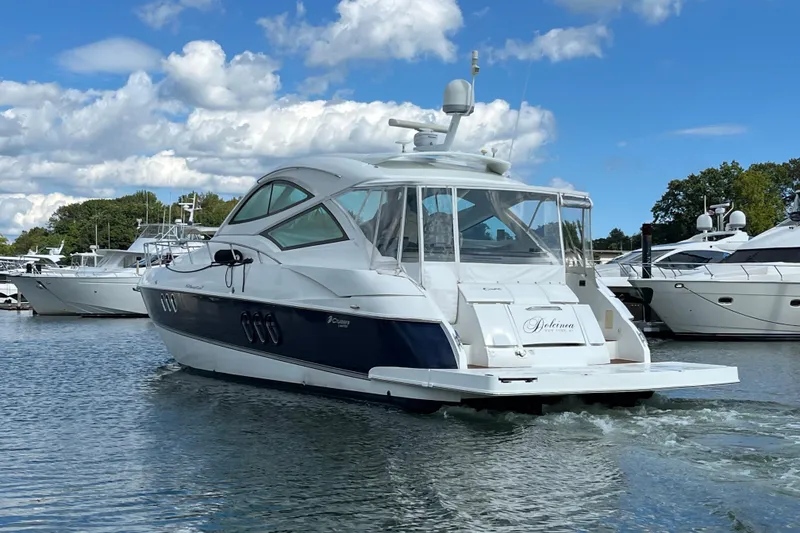 Slide: The Image of Luxurious cabin interior of 2010 Cruisers Yachts 520 Sports Coupe with elegant bedding. - 21