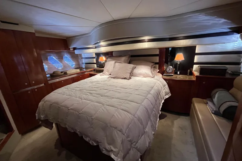 Slide: The Image of Luxurious bedroom interior of 2010 Cruisers Yachts 520 Sports Coupe with cozy bedding. - 25