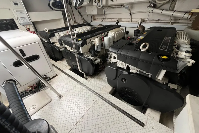 Slide: The Image of Engine room of 2010 Cruisers Yachts 520 Sports Coupe with dual engines and control systems. - 27