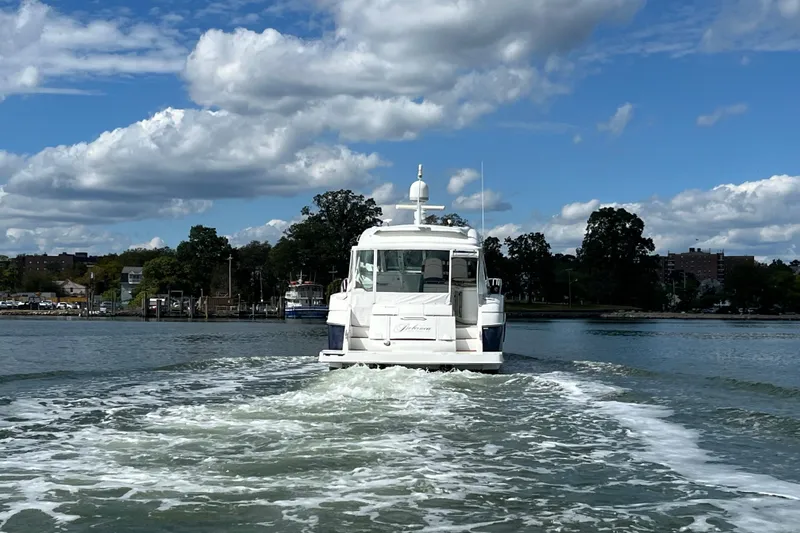 Slide: The Image of 2010 Cruisers Yachts 520 Sports Coupe sailing on a sunny day. - 5