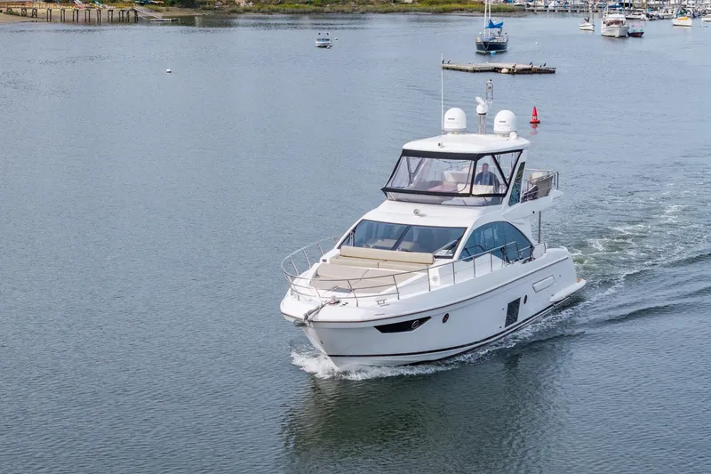 Slide: The Image of 2020 Azimut Fly 50 yacht cruising on a calm waterway. - 19