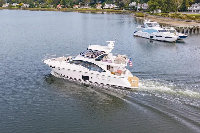 Slide: The Image of Azimut Fly 50 yacht cruising on a serene lake, 2020 model. - 20