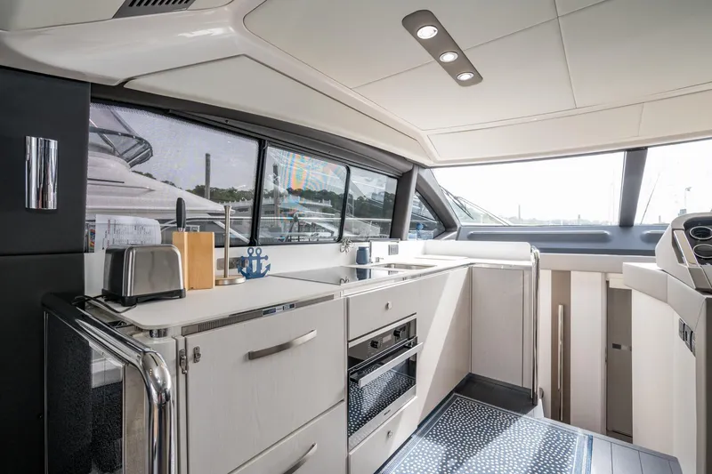 Slide: The Image of Luxurious interior of 2020 Azimut Fly 50 yacht with modern kitchen amenities. - 31