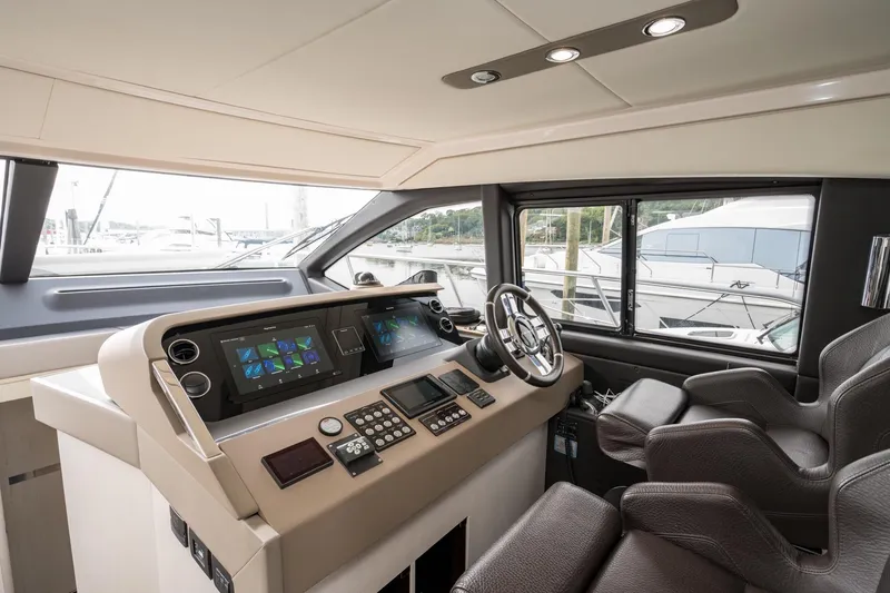 Slide: The Image of Luxurious 2020 Azimut Fly 50 yacht cockpit with modern navigation controls and plush seating. - 55