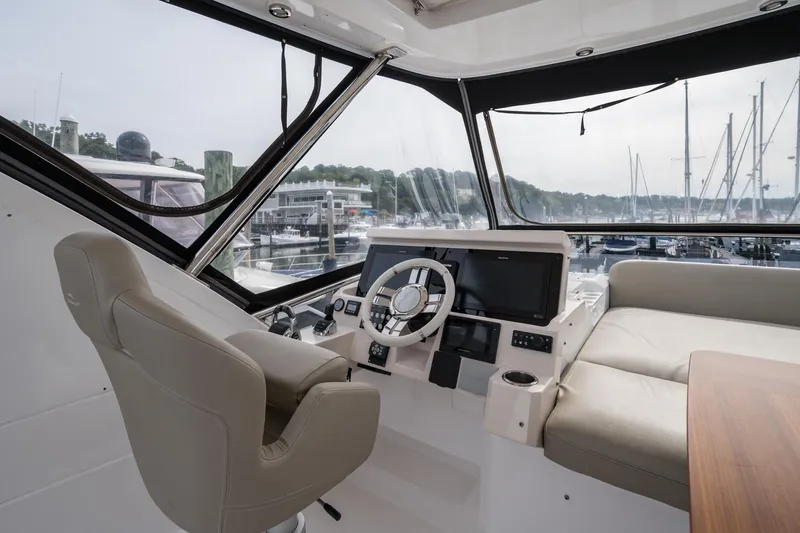 Slide: The Image of Interior view of 2020 Azimut Fly 50 yacht cockpit with modern controls and seating. - 69