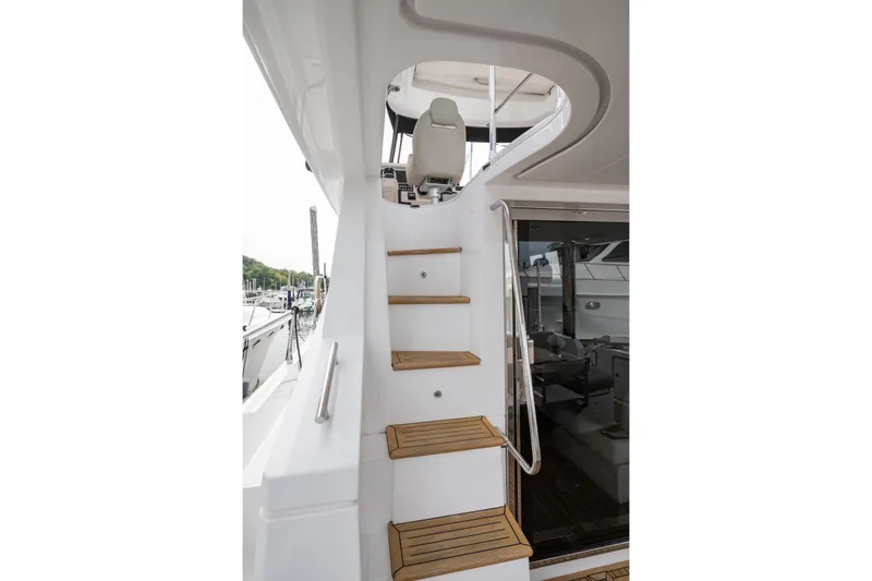 Slide: The Image of Staircase on 2020 Azimut Fly 50 yacht with wooden steps and sleek design. - 75