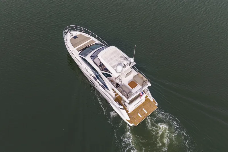 Slide: The Image of Aerial view of 2020 Azimut Fly 50 yacht cruising on calm water. - 77