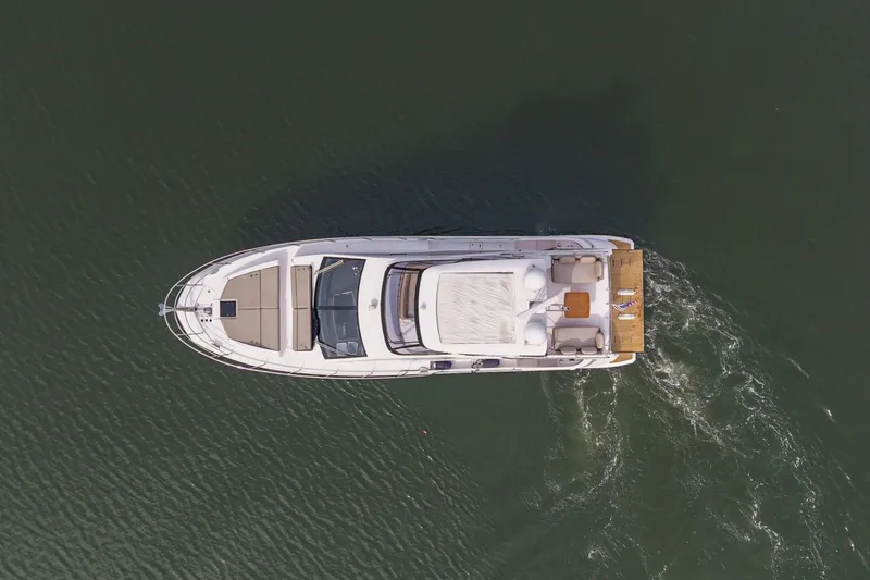 Slide: The Image of Overhead view of 2020 Azimut Fly 50 yacht cruising on water. - 78