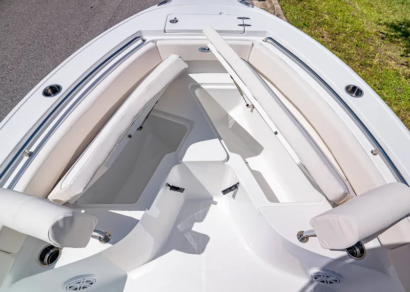 Slide: The Image of 2026 Sea Hunt Ultra 219 boat interior with cushioned seating and storage compartments. - 20