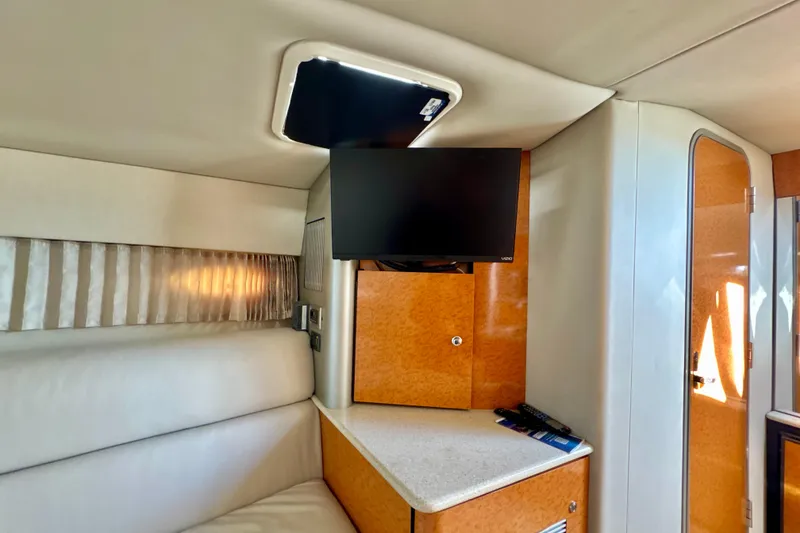 Slide: The Image of Interior of a 2006 Formula 370 Super Sport boat with TV and seating area. - 16